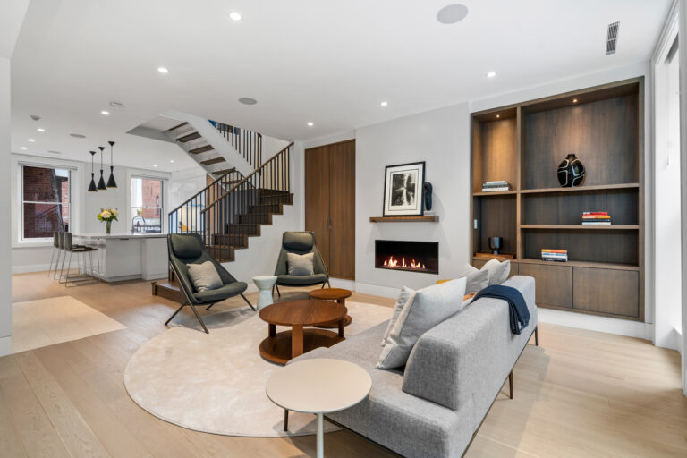 47 Hancock street view of kitchen from living room; Renovated kitchen at 47 Hancock Street, designed by ArnoldAnd to balance historic brownstone charm with modern functionality. Custom millwork and built-in storage solutions at 47 Hancock Street by ArnoldAnd. Reconfigured floor plan enhancing flow and functionality in this Boston brownstone renovation by ArnoldAnd.