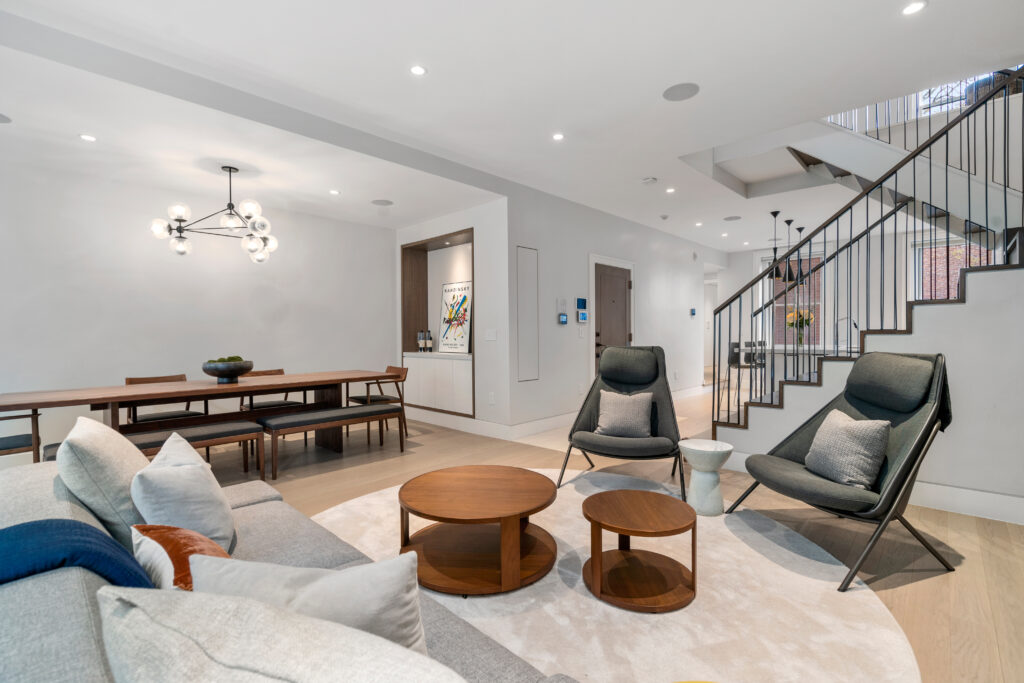 47 Hancock street living room with stairs; Renovated kitchen at 47 Hancock Street, designed by ArnoldAnd to balance historic brownstone charm with modern functionality. Custom millwork and built-in storage solutions at 47 Hancock Street by ArnoldAnd. Reconfigured floor plan enhancing flow and functionality in this Boston brownstone renovation by ArnoldAnd.