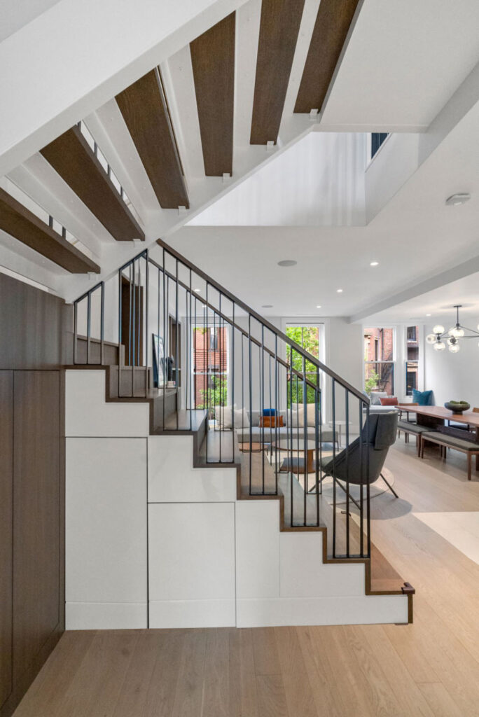 Hancock Blog stair detailBlog Renovated kitchen on Hancock Street, designed by ArnoldAnd to balance historic brownstone charm with modern functionality. Custom millwork and built-in storage solutions at 47 Hancock Street by ArnoldAnd. Reconfigured floor plan enhancing flow and functionality in this Boston brownstone renovation by ArnoldAnd.