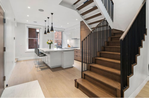 Renovated kitchen onHancock Street, designed by ArnoldAnd to balance historic brownstone charm with modern functionality. Custom millwork and built-in storage solutions at 47 Hancock Street by ArnoldAnd. Reconfigured floor plan enhancing flow and functionality in this Boston brownstone renovation by ArnoldAnd.