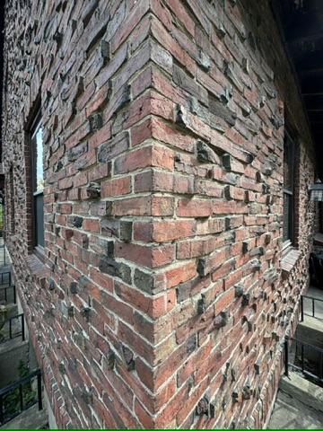 Clinker House Exterior detail of clinker brick facade in Boston renovation by ArnoldAnd Architecture.