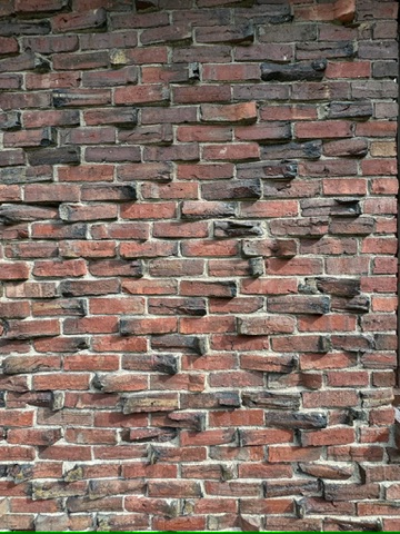 Clinker House Exterior detail of clinker brick facade in Boston renovation by ArnoldAnd Architecture.