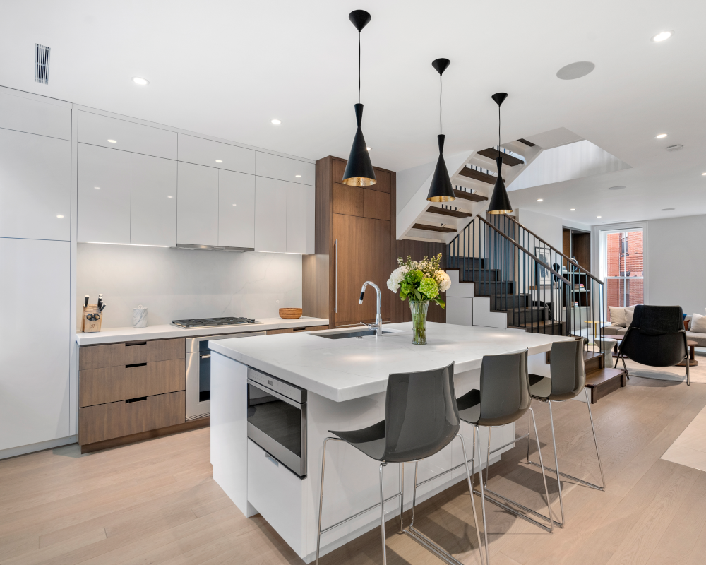 Hancock Kitchen stairBlog; Renovated kitchen on Hancock Street, designed by ArnoldAnd to balance historic brownstone charm with modern functionality. Custom millwork and built-in storage solutions at 47 Hancock Street by ArnoldAnd. Reconfigured floor plan enhancing flow and functionality in this Boston brownstone renovation by ArnoldAnd.