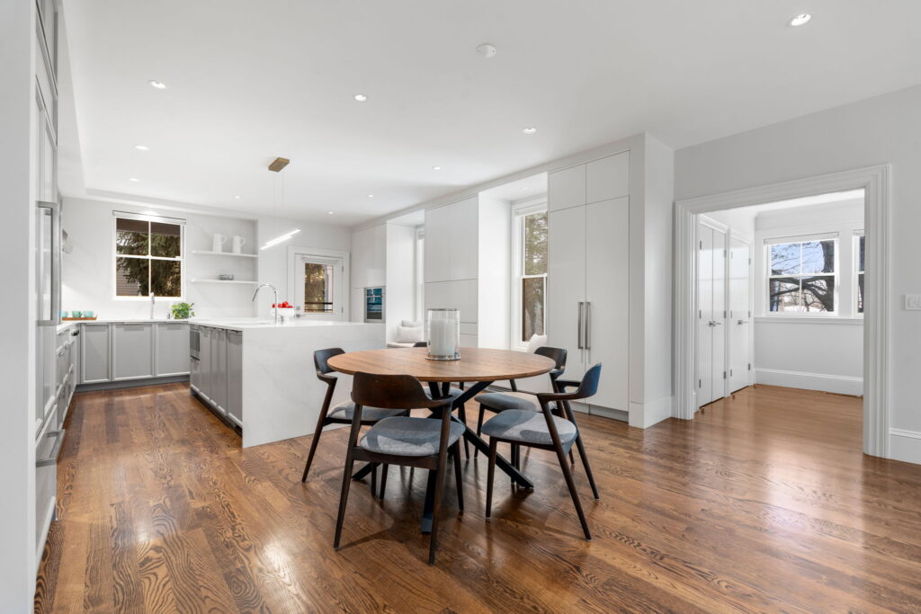 Modern kitchen renovation Newton MA with warm gray cabinetry and stone island