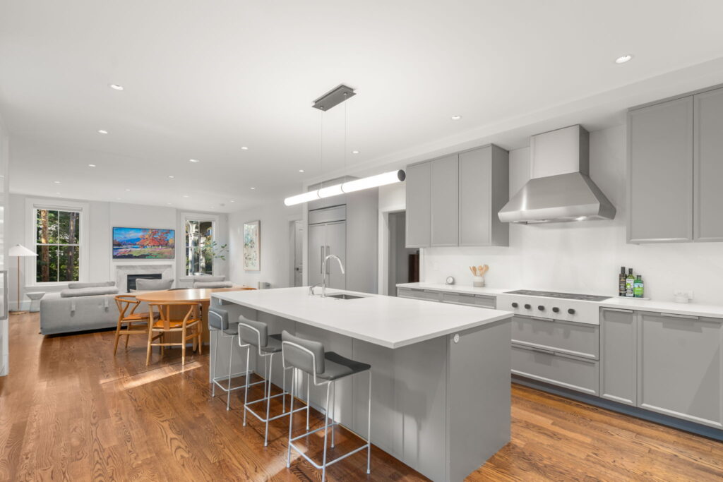 Modern kitchen renovation Newton MA with warm gray cabinetry and stone island
