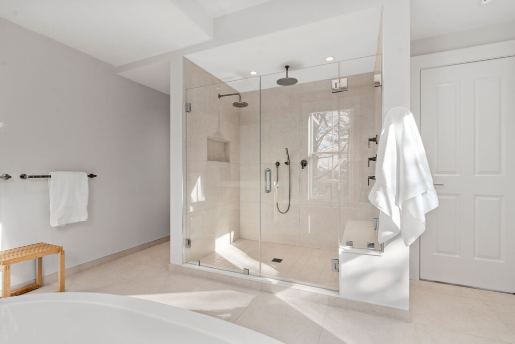 rimary bathroom renovation Newton MA with clean modern finishes