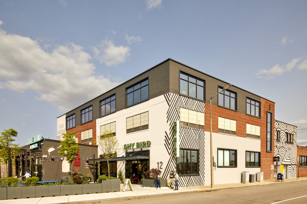 Iron Works is a large-scale adaptive reuse and repositioning of a historic industrial complex in South Boston. The project transforms a former mill into a vibrant, mixed-use destination, bringing together food, fitness, and production under one cohesive identity.