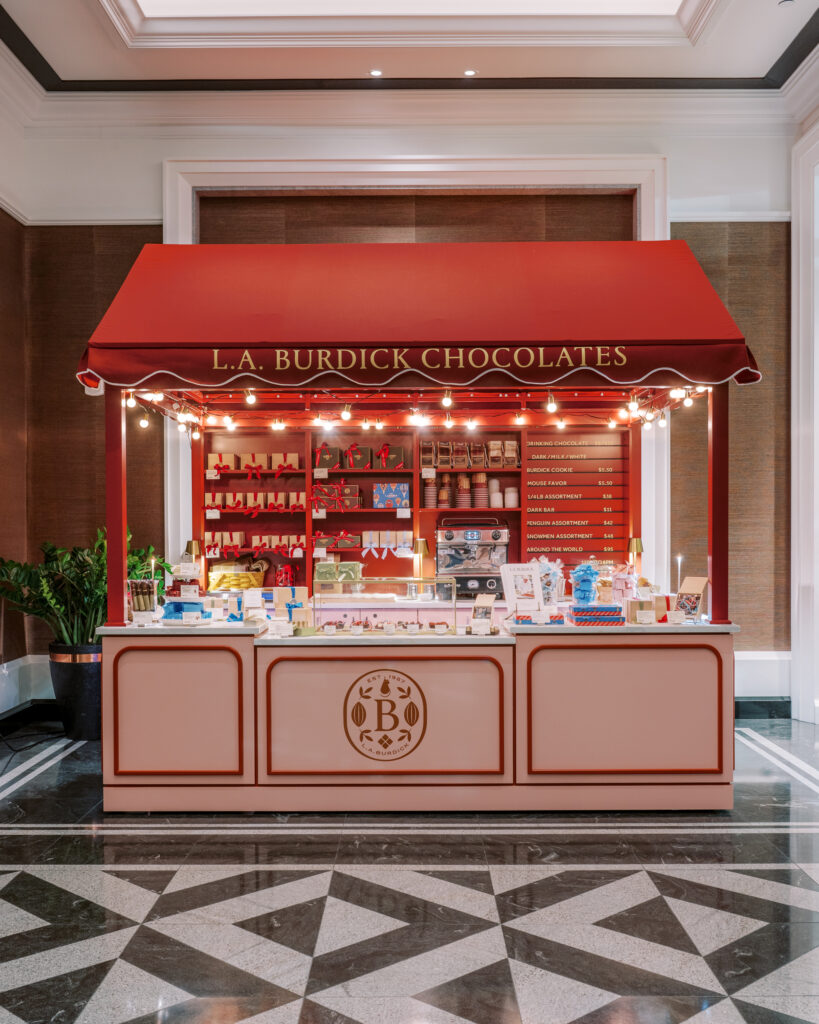 With its strategic placement in the main lobby, this micro-retail moment gives hotel guests and locals alike a reason to linger, and to indulge. Whether you're grabbing a gift box or a cup of the famous drinking chocolate, the experience feels special, tactile, and unmistakably Burdick.