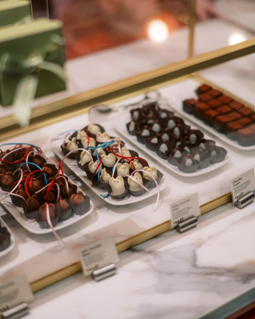 With its strategic placement in the main lobby, this micro-retail moment gives hotel guests and locals alike a reason to linger, and to indulge. Whether you're grabbing a gift box or a cup of the famous drinking chocolate, the experience feels special, tactile, and unmistakably Burdick.